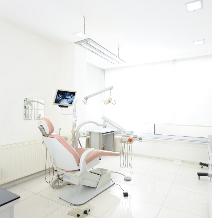 Dental treatment room with white walls