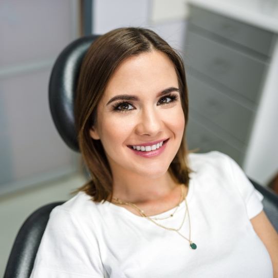 Woman smiling in dental chair at Mansfield dental office