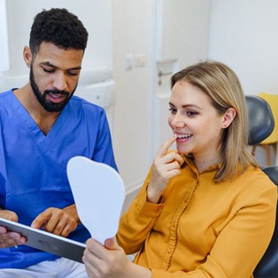 Dentist and patient talking during consultation