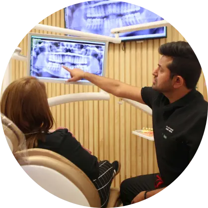 Man and woman standing and chatting in an office
