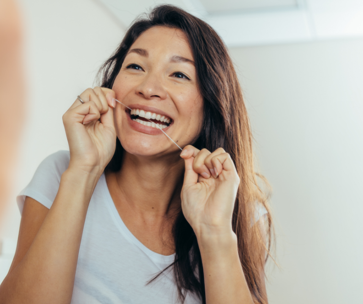 Woman flossing